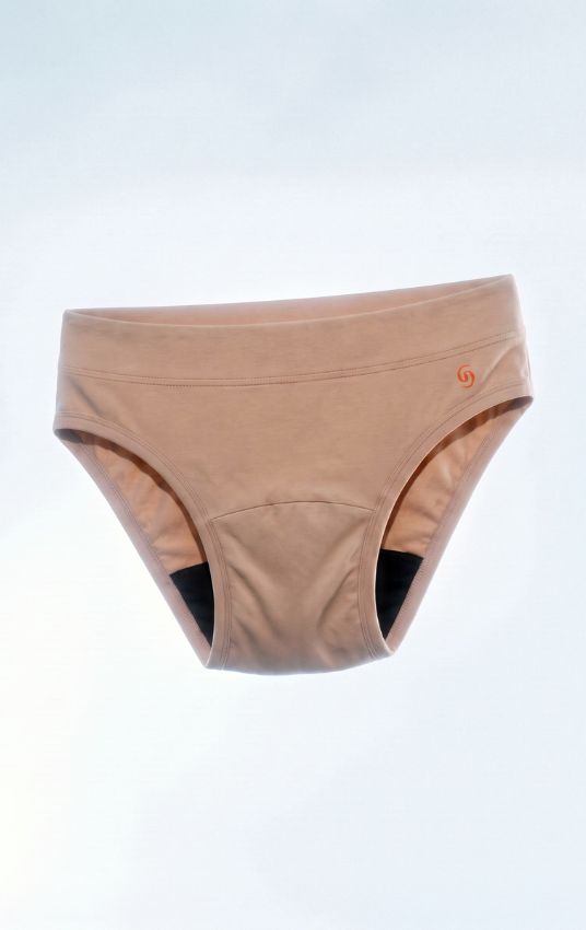 A pair of women's underwear in a light tan/beige color, shown floating against a light gray gradient background. A small orange logo is visible on the right hip.